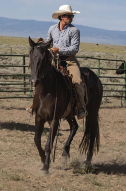 A young man wearing a cowboy hat