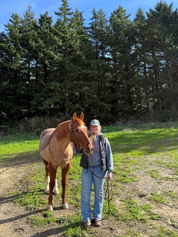 a young woman with a horse