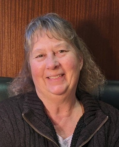  Headshot of a smiling woman