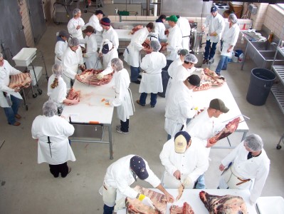 Students are shown learning how to cut meat