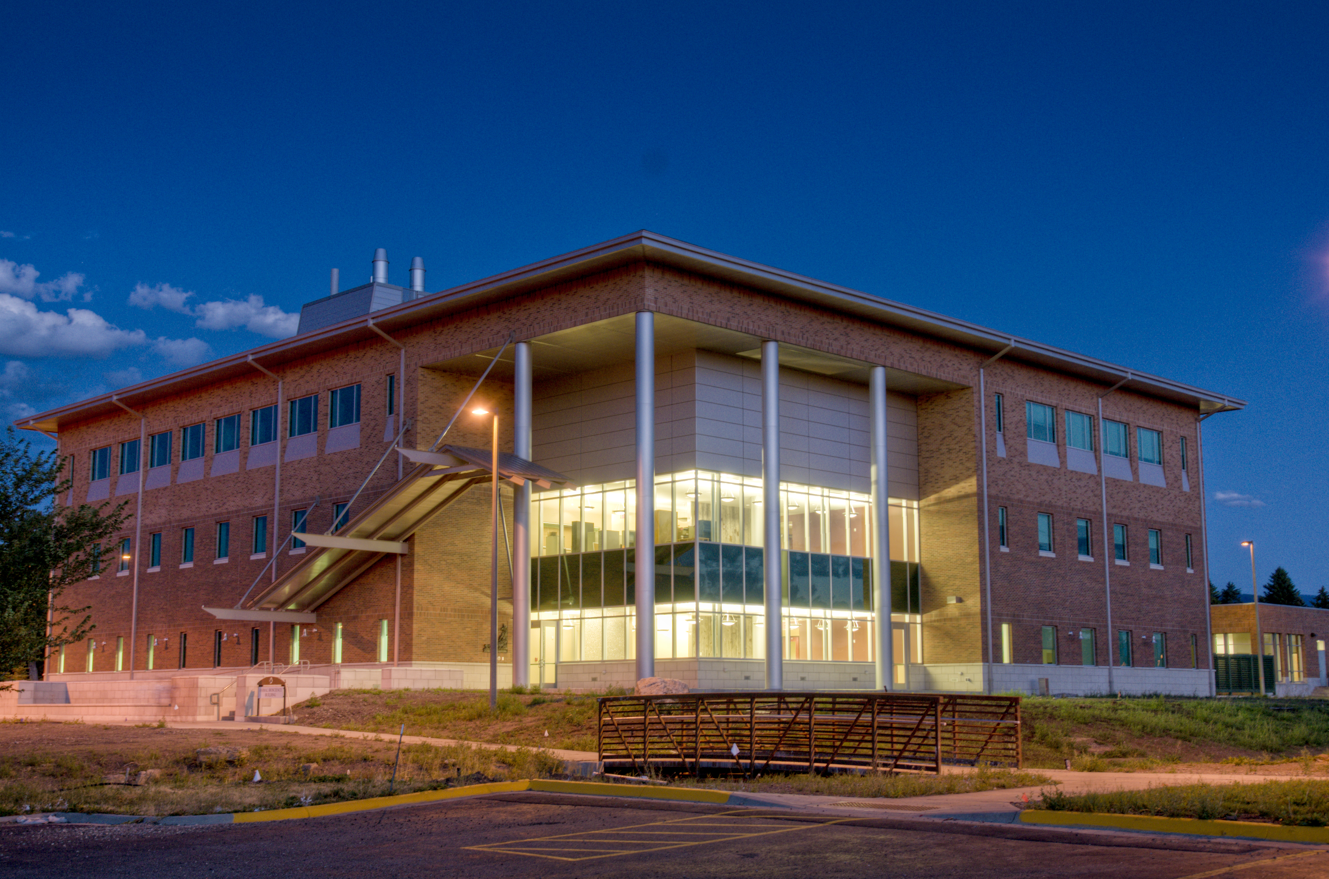 a three-story building shown at night