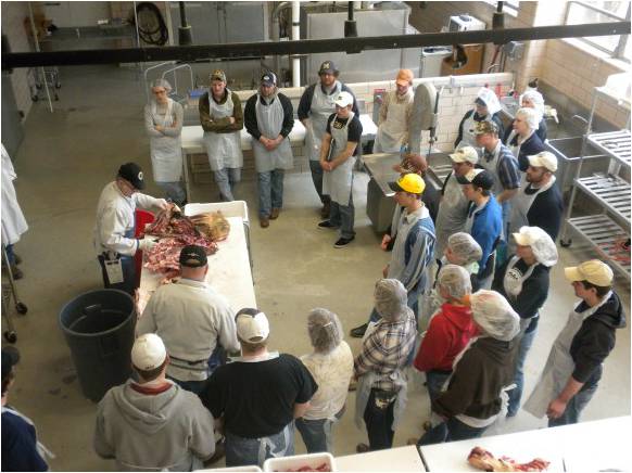 students in a meat lab